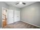 Bedroom with neutral carpet, double door closets, and a ceiling fan at 6183 Whitetail Run, Greenwood, IN 46143