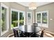 Bright breakfast nook with large windows offering natural light and views of the backyard at 6183 Whitetail Run, Greenwood, IN 46143