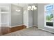 Welcoming foyer featuring hardwood floors, modern lighting fixtures, and an arched doorway for guests at 6183 Whitetail Run, Greenwood, IN 46143