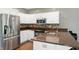 Kitchen features stainless steel appliances, tile backsplash, and granite countertops at 6183 Whitetail Run, Greenwood, IN 46143