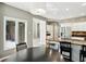 Kitchen with stainless steel appliances and breakfast nook offering views of the backyard at 6183 Whitetail Run, Greenwood, IN 46143