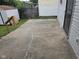 Exterior view of back patio with view of shed and side of house at 624 Warren Ave, Indianapolis, IN 46221