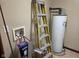 View of basement, showing hot water tank and water supply at 624 Warren Ave, Indianapolis, IN 46221