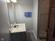 Bathroom featuring vanity and mirror at 624 Warren Ave, Indianapolis, IN 46221