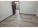View of open door leading into bedroom featuring gray walls and hardwood flooring at 624 Warren Ave, Indianapolis, IN 46221