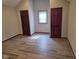 Spacious bedroom featuring hardwood floors, neutral paint, and two closets at 624 Warren Ave, Indianapolis, IN 46221