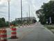 Street view with a sports stadium beyond orange traffic cones at 624 Warren Ave, Indianapolis, IN 46221