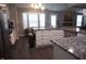 Modern kitchen featuring granite countertops, stainless steel appliances, and a breakfast bar at 6422 Hollingsworth Dr, Indianapolis, IN 46268