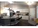 Modern kitchen featuring granite countertops, stainless steel appliances, white cabinets, and a breakfast bar at 6422 Hollingsworth Dr, Indianapolis, IN 46268