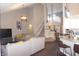 Spacious living room showcasing an open floor plan, staircase, and modern decor at 6422 Hollingsworth Dr, Indianapolis, IN 46268