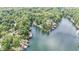 Scenic aerial view of lakefront homes nestled among lush green trees and serene waters at 6497 Osprey Dr, Nineveh, IN 46164