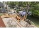 Stunning aerial view of a tiered deck leading to the lake with docks and boat slips at 6497 Osprey Dr, Nineveh, IN 46164