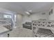 Finished basement with bunkbeds and a loveseat showing an updated and cozy living space at 6497 Osprey Dr, Nineveh, IN 46164