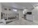 Finished basement including bunk beds, a kitchenette, and a walk-out door to the exterior at 6497 Osprey Dr, Nineveh, IN 46164