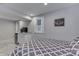 Bright bedroom area featuring a mini-fridge and TV, adjacent to the bed at 6497 Osprey Dr, Nineveh, IN 46164