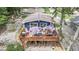 A lake house featuring an aerial view of a spacious deck with patio furniture at 6497 Osprey Dr, Nineveh, IN 46164