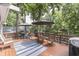 Spacious deck with a colorful rug and outdoor seating perfect for enjoying lakeside views at 6497 Osprey Dr, Nineveh, IN 46164