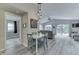 Open dining area flows into living room with vaulted ceiling and patio access at 6497 Osprey Dr, Nineveh, IN 46164