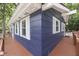 A close-up view of the blue siding of a lake house with white trim at 6497 Osprey Dr, Nineveh, IN 46164