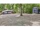 Quaint home with a large gravel yard and a storage shed in a wooded setting at 6497 Osprey Dr, Nineveh, IN 46164