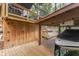 Exterior view of multi-level decks and boat lift with an adjacent boat at 6497 Osprey Dr, Nineveh, IN 46164