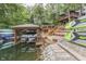 Home exterior showing multi-level decks, boat lifts, and waterfront with room for kayaks at 6497 Osprey Dr, Nineveh, IN 46164