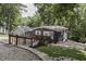 Charming home with a wooden deck and landscaped yard, nestled in a serene wooded area at 6497 Osprey Dr, Nineveh, IN 46164