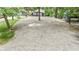 Spacious gravel driveway leading to a cozy home surrounded by lush greenery at 6497 Osprey Dr, Nineveh, IN 46164