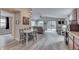 Open concept living area with dining room, vaulted ceilings, and plenty of light at 6497 Osprey Dr, Nineveh, IN 46164