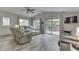 Comfortable living room with vaulted ceiling, ceiling fan, and patio access at 6497 Osprey Dr, Nineveh, IN 46164