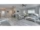 Spacious living room with vaulted ceiling, ample seating, and view to dining area at 6497 Osprey Dr, Nineveh, IN 46164