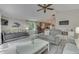 Inviting living room with grey sofa, daybed, and view into kitchen at 6497 Osprey Dr, Nineveh, IN 46164