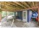 Covered patio with blue exterior and decor provides a shady retreat at 6497 Osprey Dr, Nineveh, IN 46164