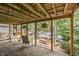 Covered patio overlooks a serene water view, enhancing relaxation and entertainment at 6497 Osprey Dr, Nineveh, IN 46164