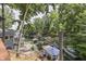 Aerial view of a home with multiple decks, boat lifts, and serene lake access at 6497 Osprey Dr, Nineveh, IN 46164