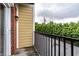 A private balcony with black metal railings offers a peaceful outdoor space with treetop views at 6556 Reserve Dr, Indianapolis, IN 46220
