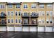 Townhome-style condos with garage parking, private balconies, and flower boxes at 6556 Reserve Dr, Indianapolis, IN 46220