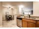 Charming kitchen features stainless steel appliances, granite countertops, and a view of the dining area at 6556 Reserve Dr, Indianapolis, IN 46220