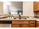 Close-up shot of the kitchen sink and counter with granite countertops and stainless steel appliances at 6556 Reserve Dr, Indianapolis, IN 46220