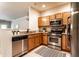 Modern kitchen featuring granite countertops, stainless steel appliances, and ample cabinet space at 6556 Reserve Dr, Indianapolis, IN 46220