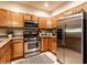 Modern kitchen with stainless steel appliances, granite countertops, and ample cabinet space, ideal for culinary enthusiasts at 6556 Reserve Dr, Indianapolis, IN 46220