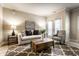Cozy living room features a comfortable sofa, stylish chairs, and a decorative rug, perfect for relaxation at 6556 Reserve Dr, Indianapolis, IN 46220