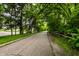 A tree-lined walking path provides residents easy access to the surrounding community and neighborhood amenities at 6556 Reserve Dr, Indianapolis, IN 46220