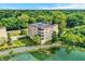 Beautiful aerial view of a multi-Gathering home surrounded by lush greenery and scenic waters at 6640 Page Blvd # 101, Indianapolis, IN 46220