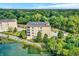 Beautiful aerial shot of condos nestled near the lake and mature trees at 6640 Page Blvd # 101, Indianapolis, IN 46220