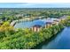 Sprawling aerial view of lake condos amidst lush greenery and a tranquil lake at 6640 Page Blvd # 101, Indianapolis, IN 46220