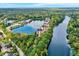 Expansive aerial of lakeside condo community surrounded by lush greenery and waterways at 6640 Page Blvd # 101, Indianapolis, IN 46220
