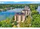 Scenic aerial view of waterfront condos with lake views, and lush foliage at 6640 Page Blvd # 101, Indianapolis, IN 46220
