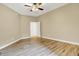 Spacious bedroom with wood floors and a ceiling fan at 6640 Page Blvd # 101, Indianapolis, IN 46220