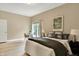Cozy bedroom featuring a window, desk, and a closet with double doors at 6640 Page Blvd # 101, Indianapolis, IN 46220